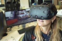 Doctoral student Debora Verniz uses a virtual-reality headset to ""visit" the favela Santa Marta in Rio de Janeiro, Brazil.