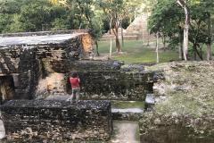 Jiawei Huang, a doctoral student in geography, conducts field work at the Cahal Pech Maya ruins in Belize, Central America.